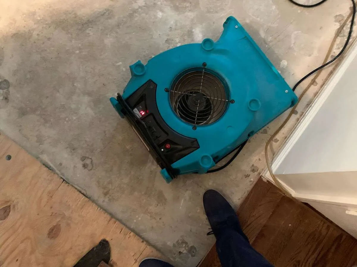 Air mover drying subfloor during Leak Detection & Repair in Carolina Forest